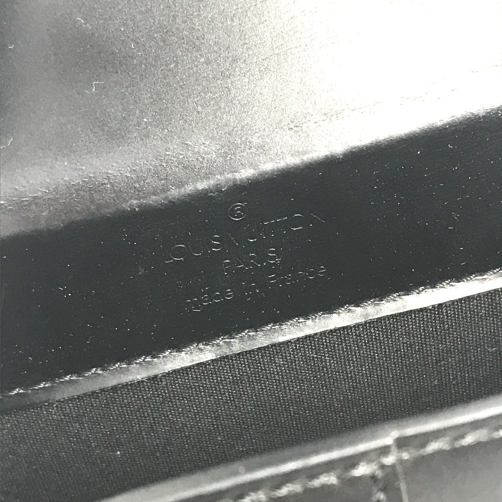 Interior view of a Louis Vuitton Vintage Pouch showcasing fine craftsmanship and iconic branding