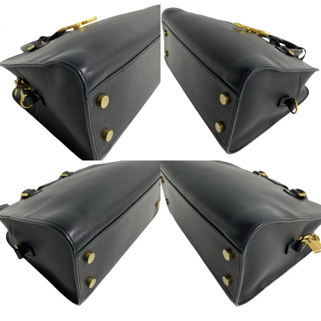 SAINT LAURENT pre-owned black leather bag with gold hardware and studded base